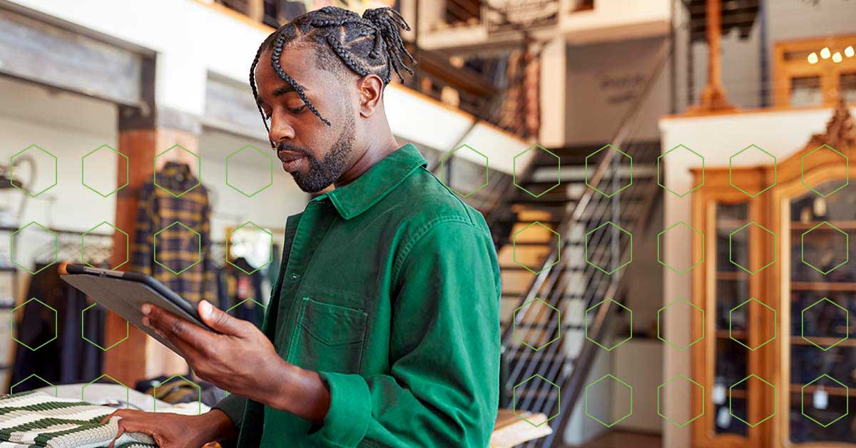 Man looking at tablet in store