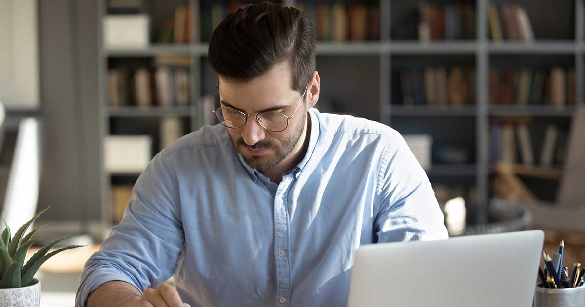 Man staring at laptop computer