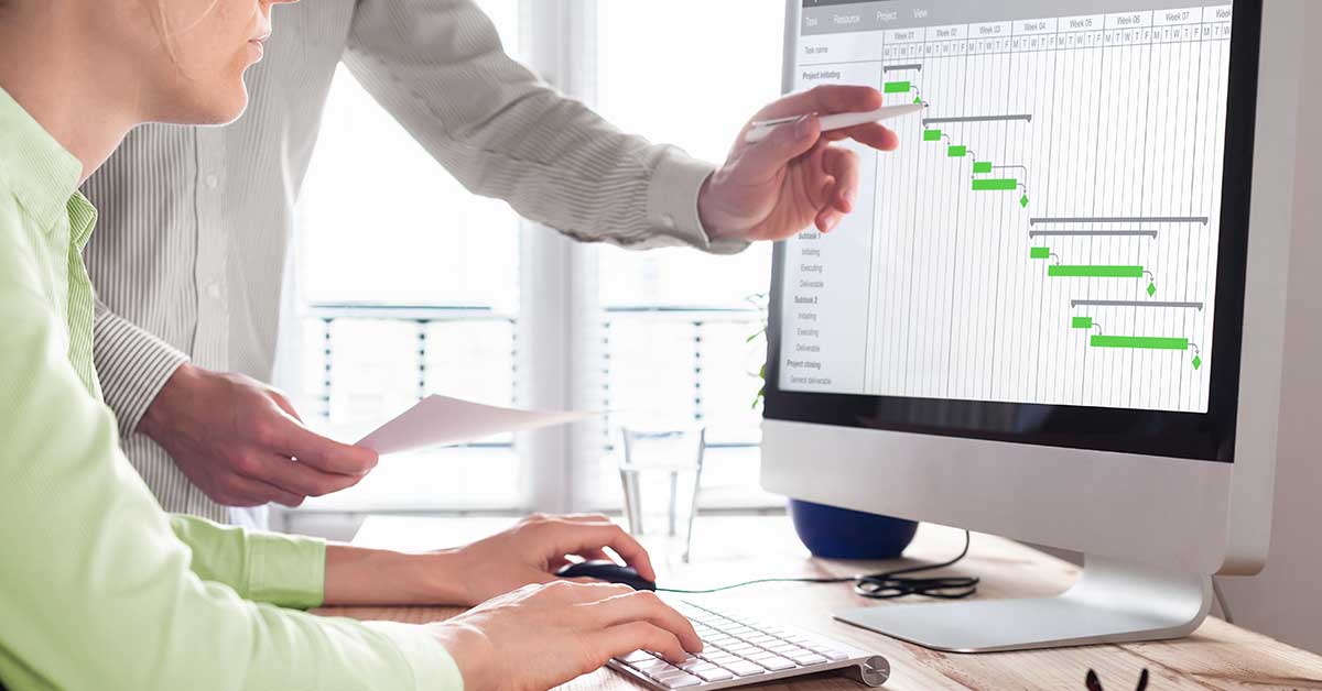 Man and woman looking at computer screen