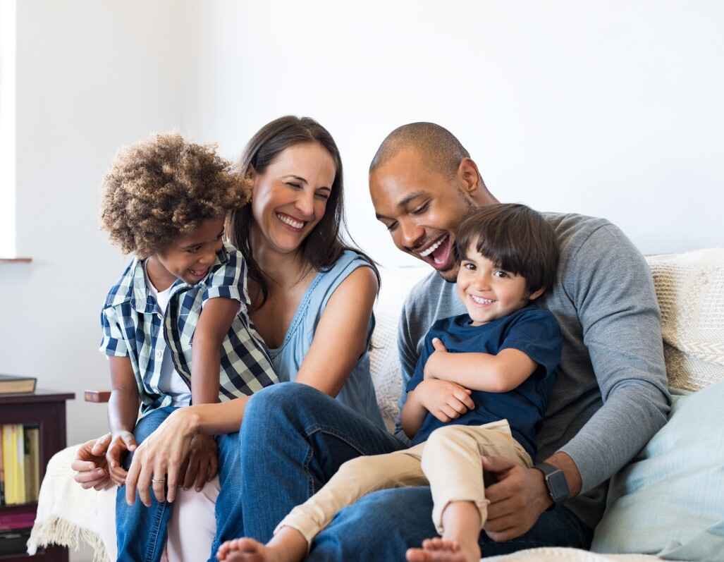 Couple with two children on their laps