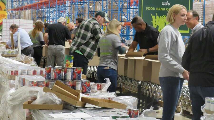 People setting up supplies for food shelf