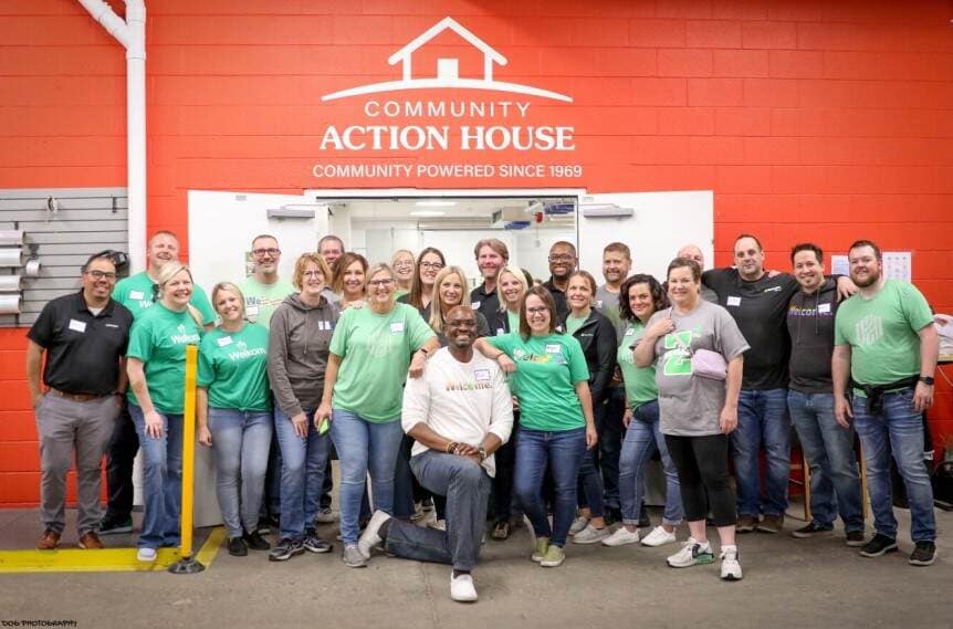 Colleagues volunteering at the Community Action House