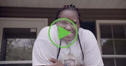 Lady on her porch smiling