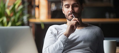 guy leaning on chair