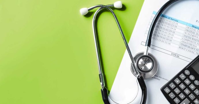 Stethoscope on green background
