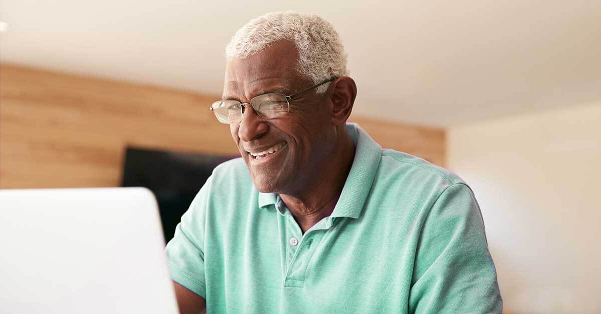 a man looks up a routing number on his computer