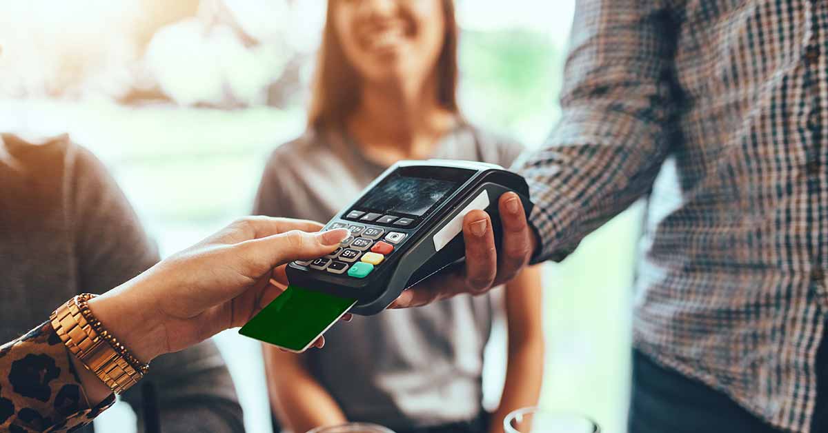 Person completing a transaction with a credit card
