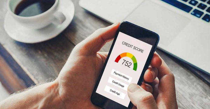 Person looking at credit score on cell phone