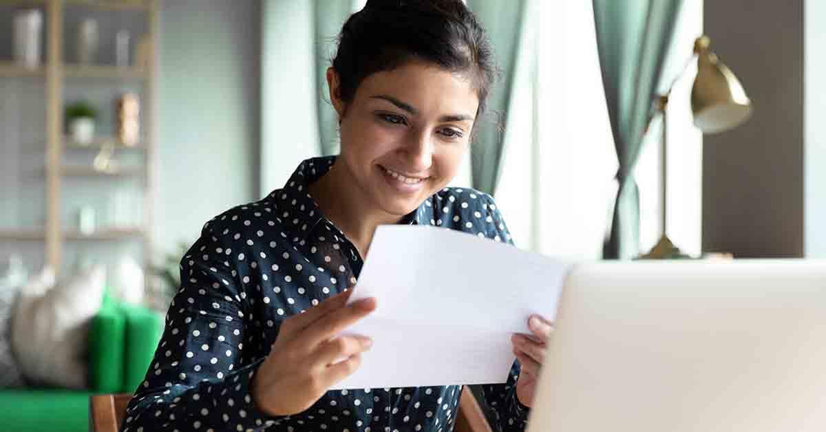 a young woman looks at short term loan paperwork