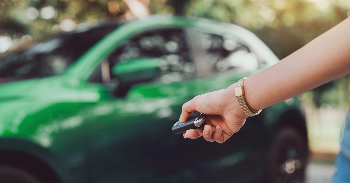women unlocking car
