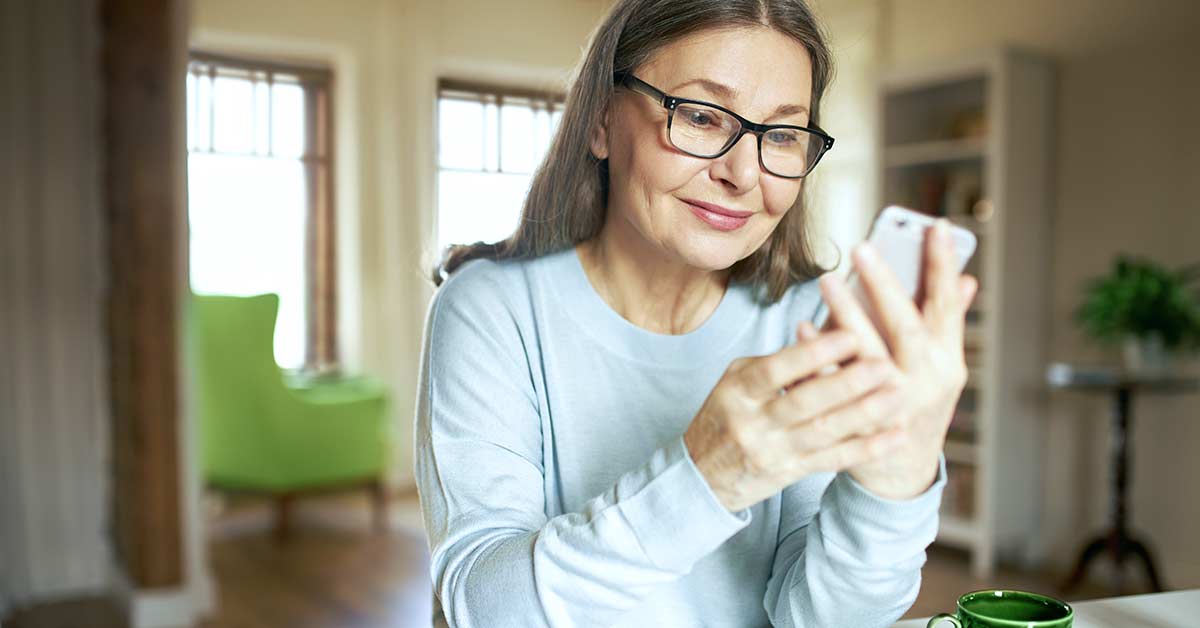Mature woman looking at phone