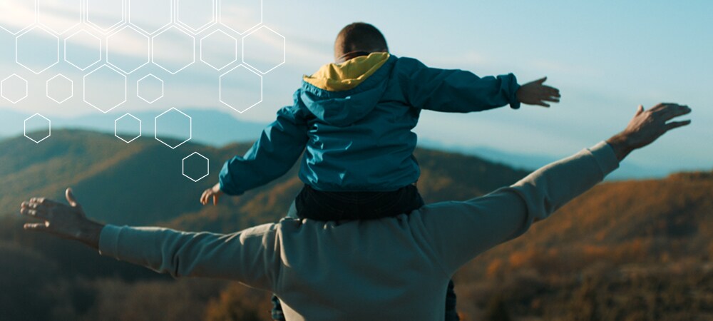 Man and son looking at mountains