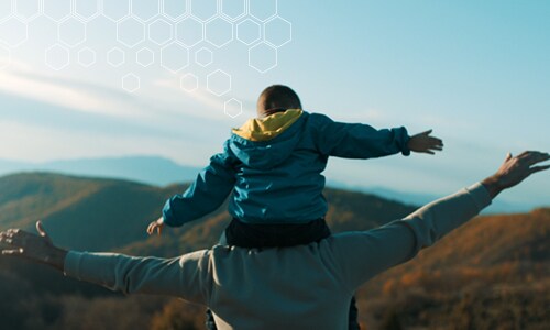 Man and son looking at mountains